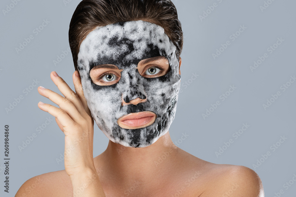 Woman with bubble sheet mask on her face Woman with bubble sheet mask on her face