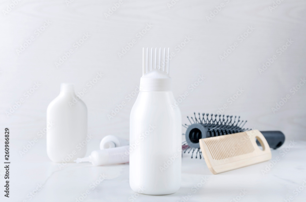 Hairdresser products for hair care at the salon.Plastic bottles with professional liquids for dye hair Hairdresser products for hair care at the salon.Plastic bottles with professional liquids for dye hair