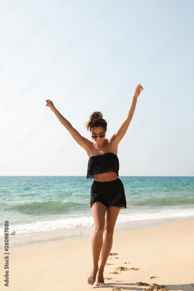 Stylish and beautiful woman on the beach Stylish and beautiful woman on the beach