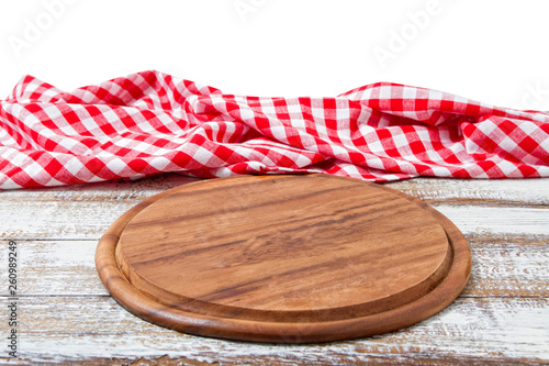 empty pizza board and tablecloth on table isolated on white background copy space © paulcannoby