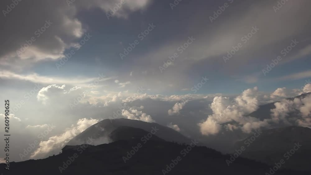 Immersive pan view of the majestic Nepalese Mountain range poking just above the clouds in Nepal Immersive pan view of the majestic Nepalese Mountain range poking just above the clouds in Nepal