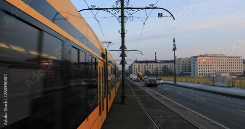 Budapest, Hungary, March 15 jan 2019 Old yellow Tram and Margaret bridge with city traffic at winter. Time lapse