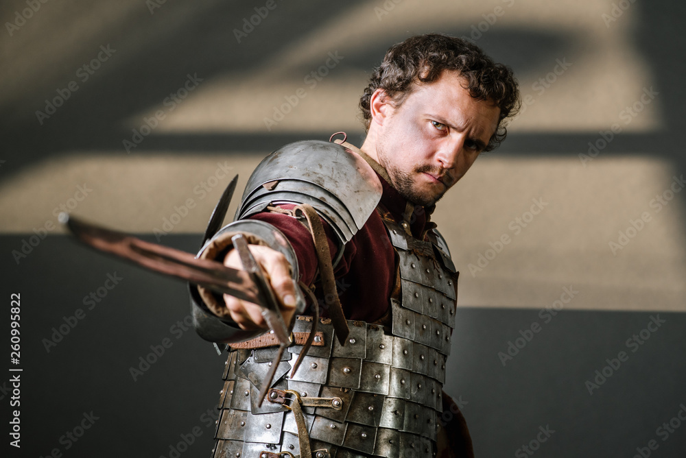 Medieval knight pointing sword to camera Stock Photo Adobe Stock