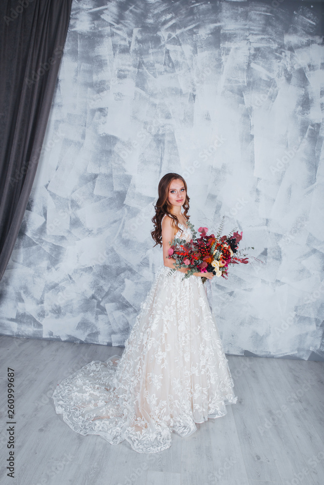 Wedding fashion bride in perfect wedding white dress with wedding bouquet Wedding fashion bride in perfect wedding white dress with wedding bouquet