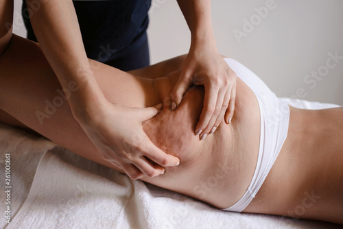 Anti cellulite massage for young woman in beauty salon. Perfect skin fat burning beauty concept
