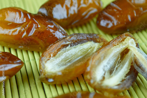 sweet algerian arabic split dates fruits open on a wooden ground