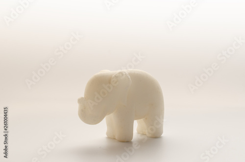 Old Toy Elephant of marble on a white background.