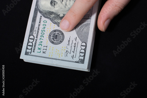 Hand holding American dollar  isolated on white background photo