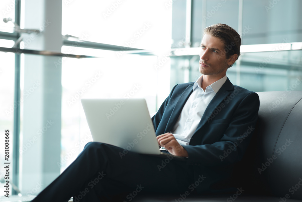 Adult serious man has business conversations using on-line mobile application. Developer innovational business web applications in the internet. Stylish guy. Business portrait. Cloud technologies. Adult serious man has business conversations using on-line mobile application. Developer innovational business web applications in the internet. Stylish guy. Business portrait. Cloud technologies.