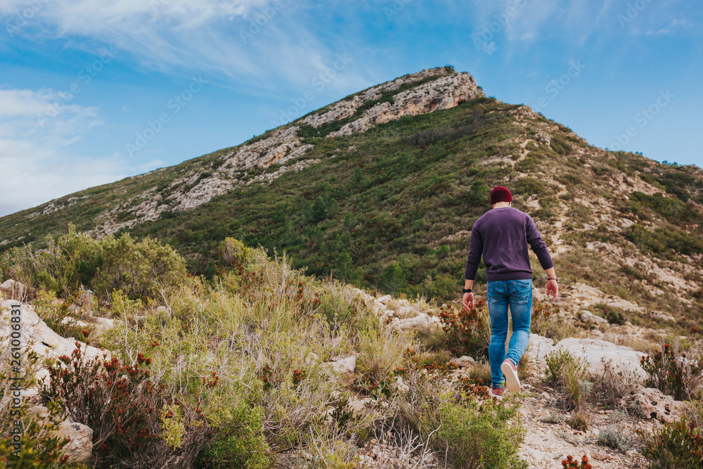 Young male hikes in mountains. Landscape scenery of spanish nature. Young male hikes in mountains. Landscape scenery of spanish nature.