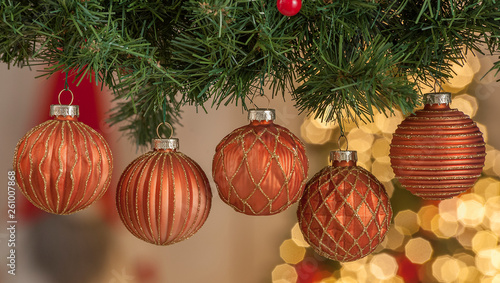 Christmas balls on a Christmas tree with light on background