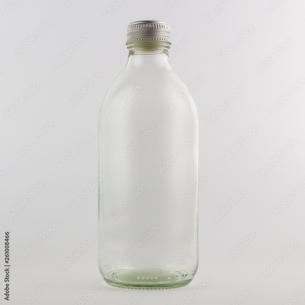 Empty glass bottle, isolated, white background Empty glass bottle, isolated, white background