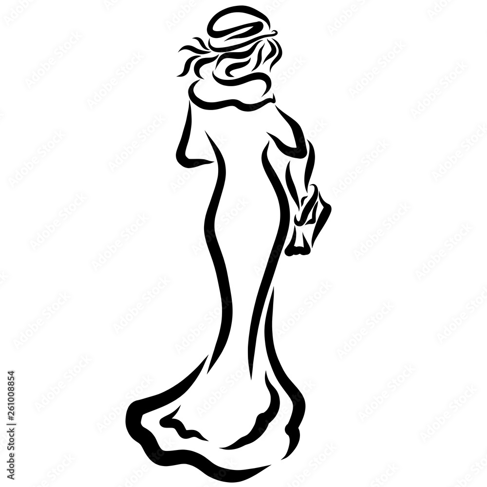 Fototapeta premium Slender lady in a long coat with a bag in her hands