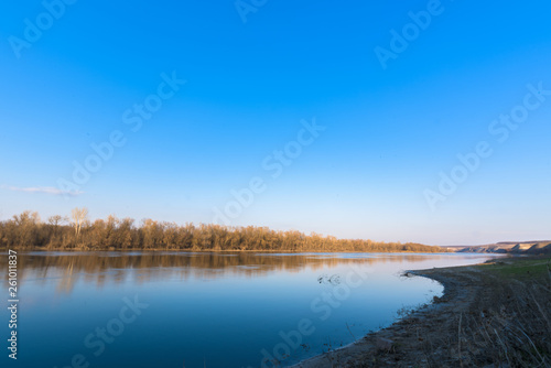 Fototapeta Naklejka Na Ścianę i Meble -  panorama of the river. wide channel, blue sky. mountain shore
