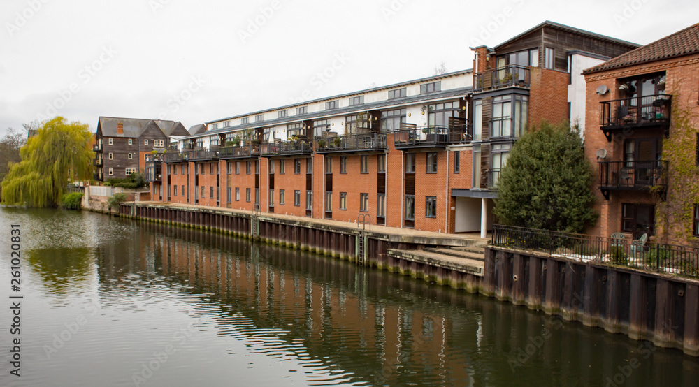 Expensive waterside apartments and penthouses on the quayside of the River Wensum in the city of Norwich, Norfolk