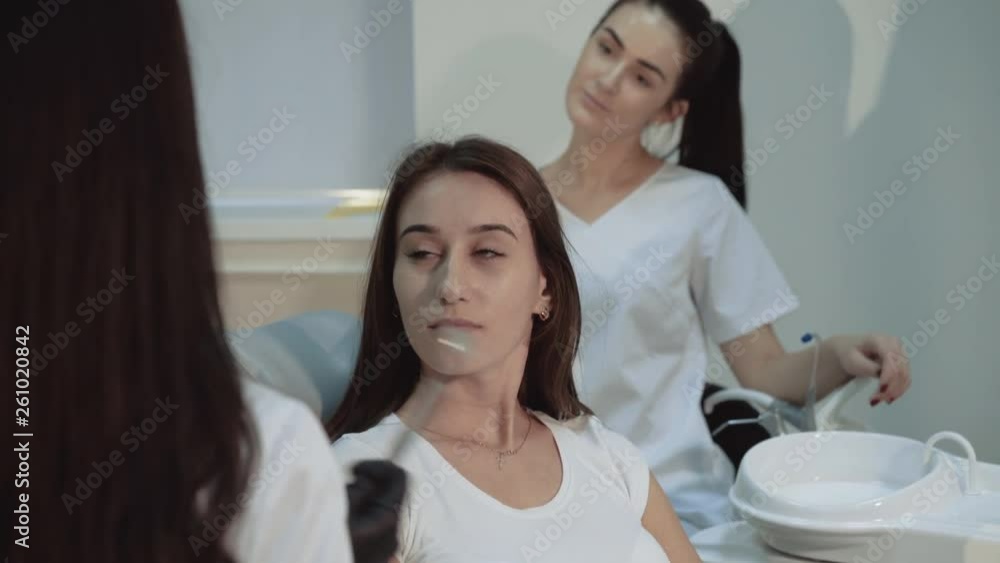 Beautiful girl sits on dentist consult in chair and smiling. 4K Beautiful girl sits on dentist consult in chair and smiling. 4K