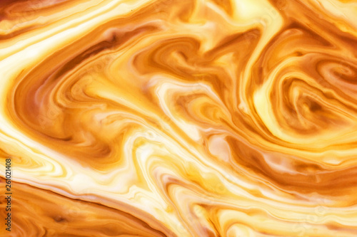Yellow and orange paint pigment mix background. Abstract swirl shapes backdrop.