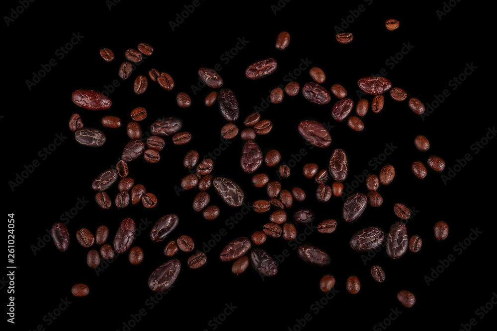 Roasted beans. Cocoa beans and coffee beans isolated on black background. Roasted beans. Cocoa beans and coffee beans isolated on black background.