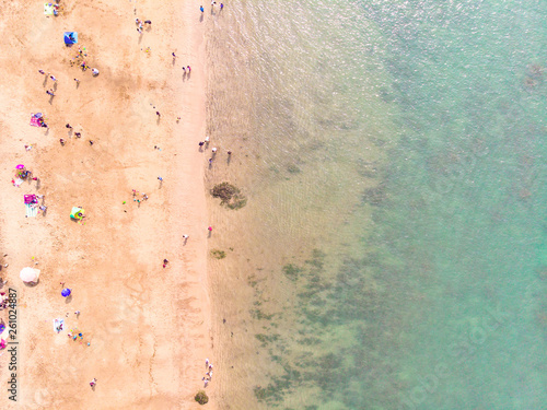 Aerial view of sandy beach with tourists swimming in beautiful clear sea water - Taiwan North Coast , shot in Sanzhi District, New Taipei, Taiwan