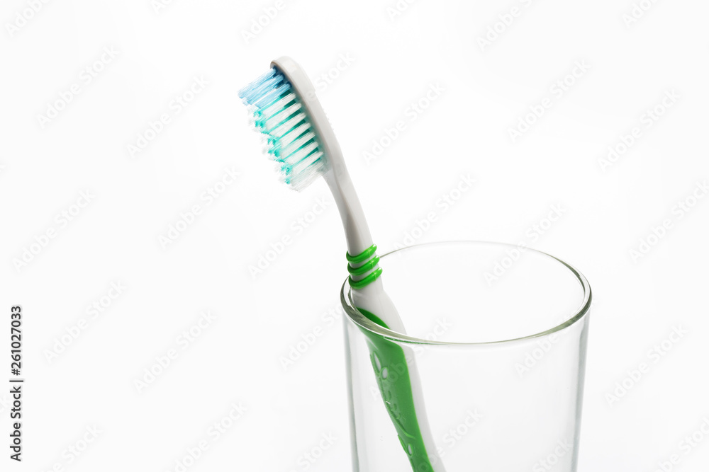 Set of toothbrushes in glass on white background. Set of toothbrushes in glass on white background.