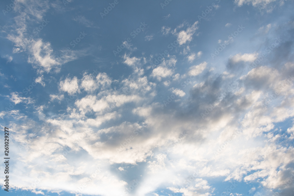 Blue sky with clouds background with sun rays Blue sky with clouds background with sun rays