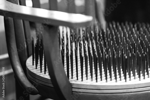 Chair with nails on the seat photo