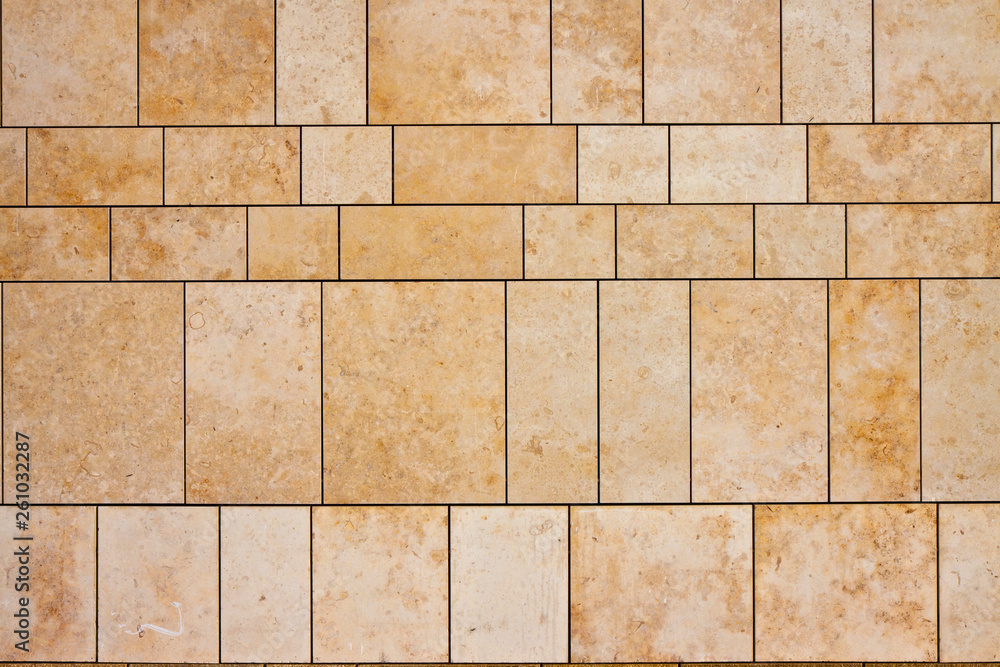 Naklejka premium New modern ventilated stone wall made with different blocks of rectangular shape with wide joints