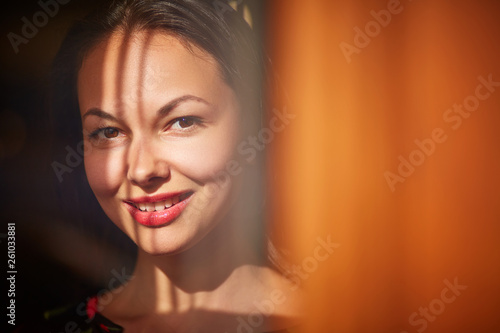 Portrait of a brunette behind the glass © Aleksey Telesh