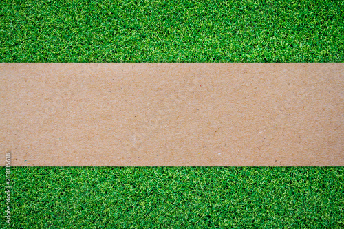 Grass background with blank brown paper label 