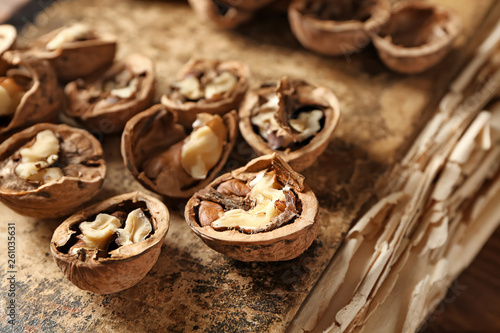 Tasty walnuts on old book, closeup