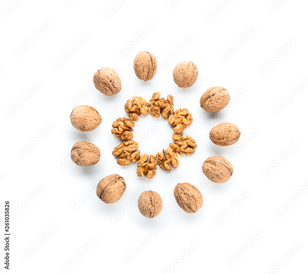 Tasty walnuts on white background