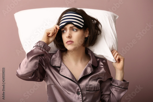 Stressed woman with mask an...
