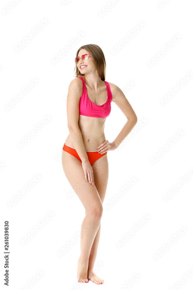 Beautiful young woman in swimming suit on white background Beautiful young woman in swimming suit on white background