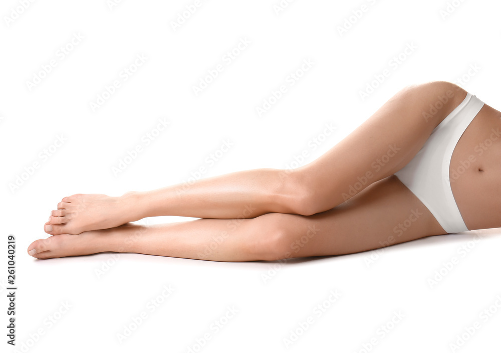 Beautiful young woman after epilation of legs on white background