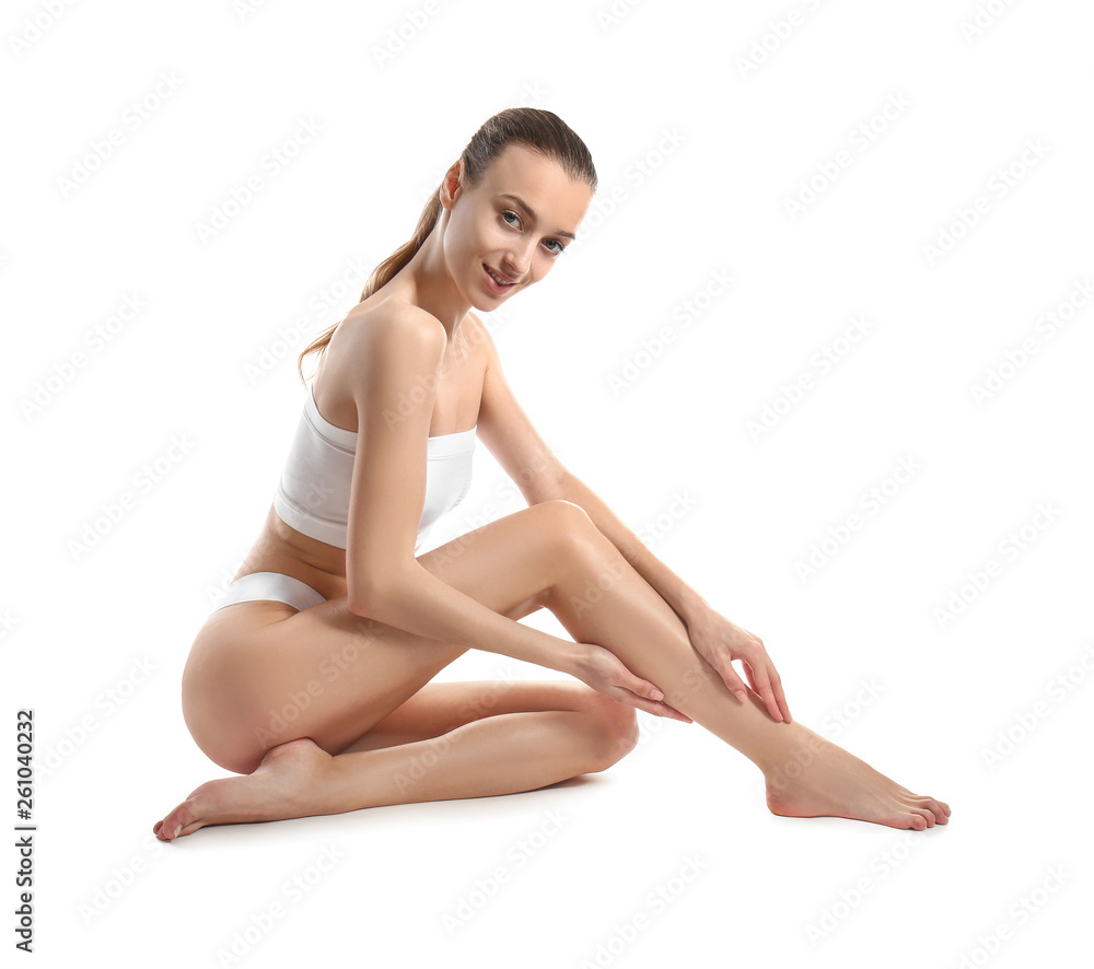 Beautiful young woman after epilation on white background