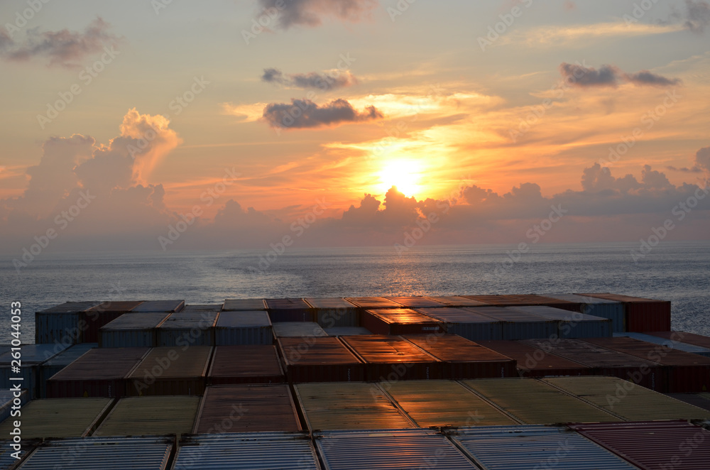 Sunset at sea, view from the cargo ship.