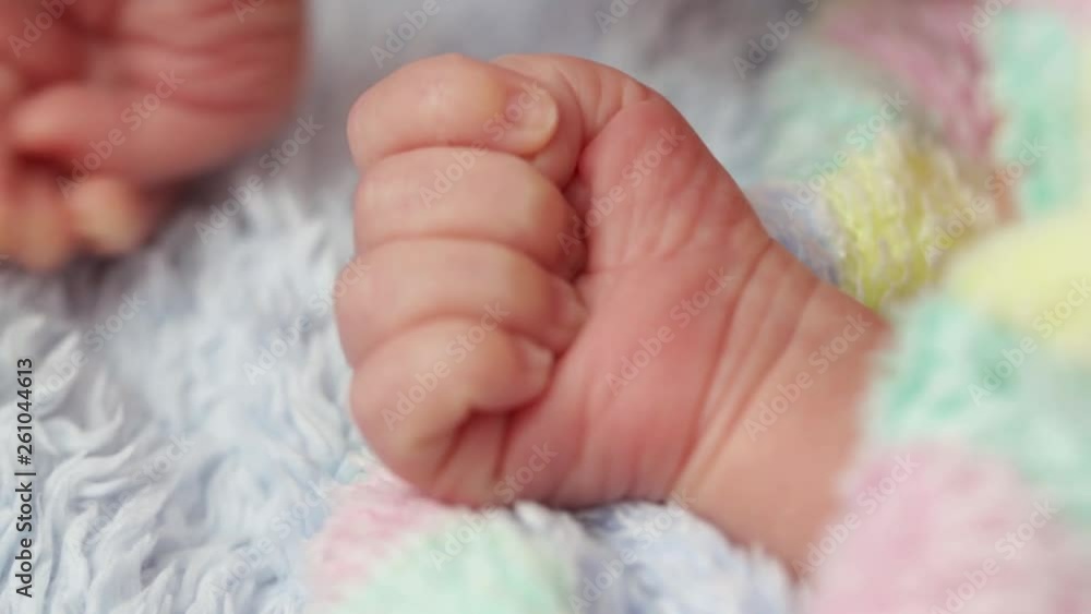 baby hands close uphands of newborn baby close-up on the crib. on the fingers you can see the grown nails baby hands close uphands of newborn baby close-up on the crib. on the fingers you can see the grown nails