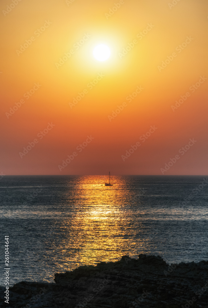 Fishing boat and sunset on sea