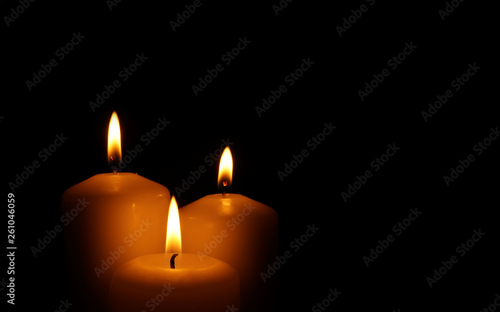 Burning candles as symbol of eternal memory.