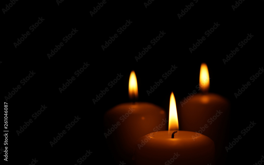 Burning candles as symbol of eternal memory.