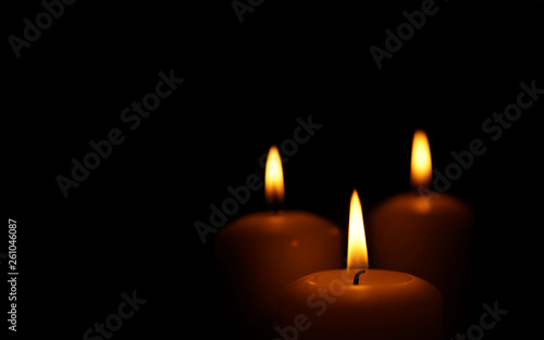 Burning candles as symbol of eternal memory.