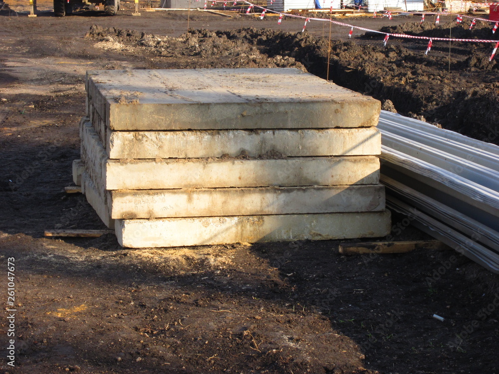 A stack of concrete slabs at a construction site A stack of concrete slabs at a construction site
