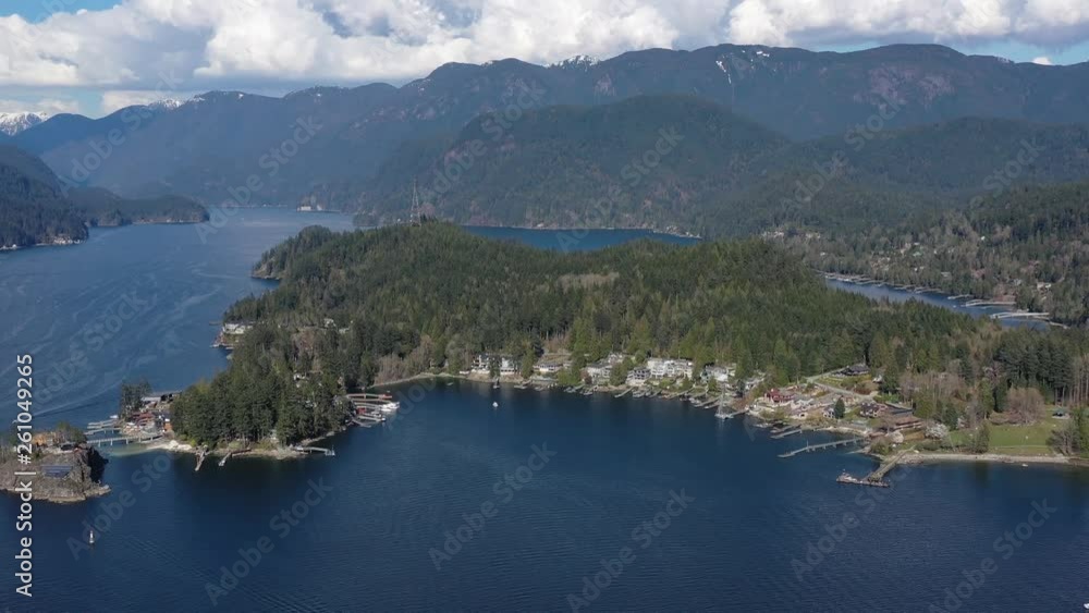 Aerial view over Burrard Inlet, ocean and island with boat and mountains in beautiful British Columbia. Canada. 4K. Aerial view over Burrard Inlet, ocean and island with boat and mountains in beautiful British Columbia. Canada. 4K.