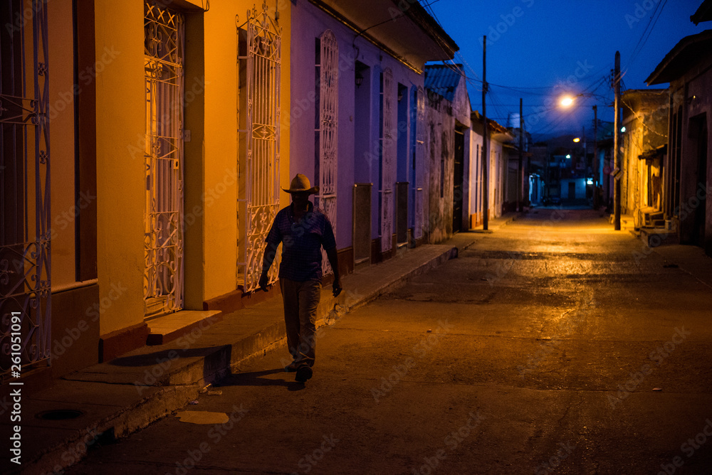 man walking in the dark