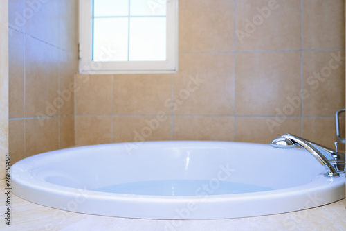 Modern bathtub full of water