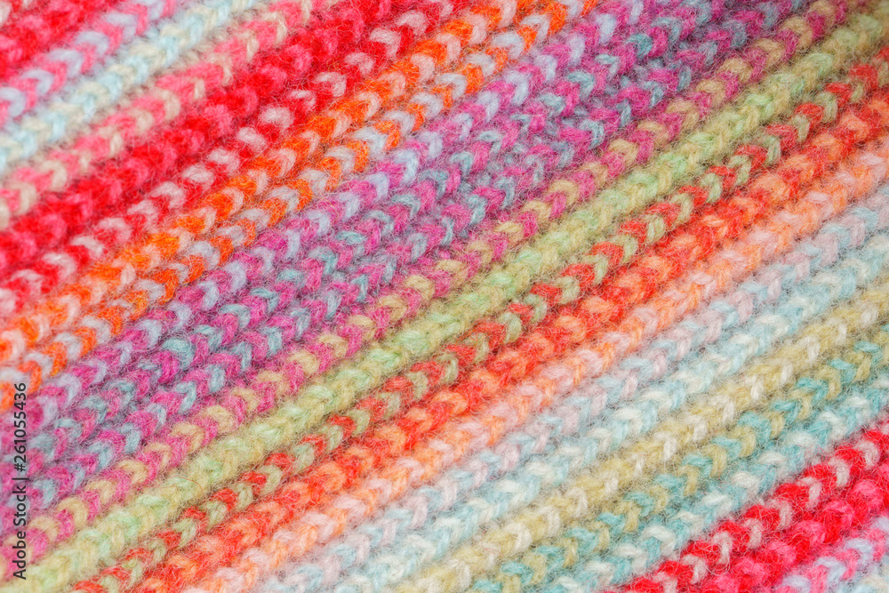 Multicolored Knitwear Sweater Fabric Texture. Bright saturated background Multicolored Knitwear Sweater Fabric Texture. Bright saturated background