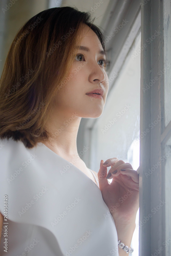 Portrait of thai adult beautiful girl relax and smile Portrait of thai adult beautiful girl relax and smile
