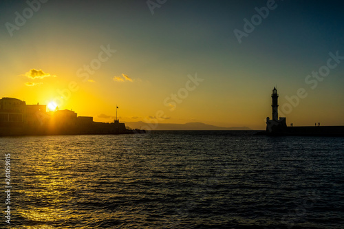 Panorama venetian harbour waterfront and Lighthouse in old harbour of Chania at sunset, Crete, Greece
