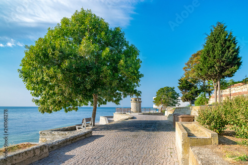 A beautiful street in Nessebar ancient city on the Bulgarian Black Sea Coast. Nesebar or Nesebr is a UNESCO World Heritage Site. A street in Nessebar on a sunny day with blue sky, Bulgaria