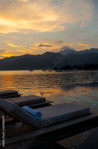 sunset on the beach of the pool